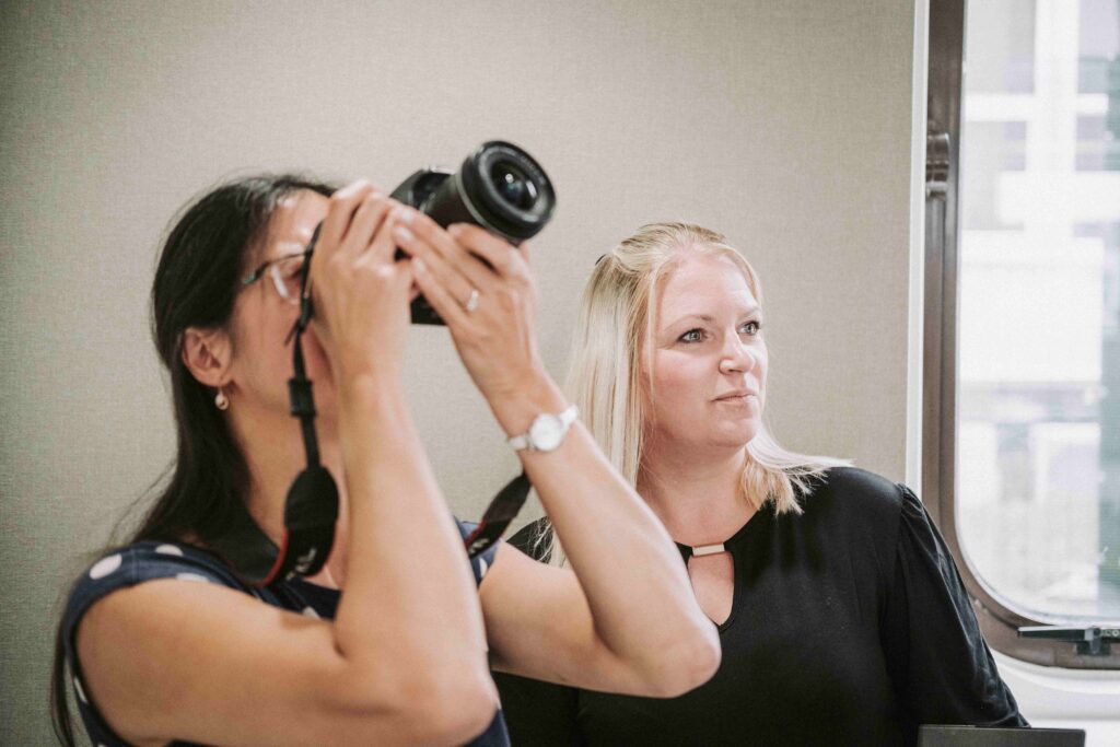 Sau is behind the camera and Rebecca is to the right behind slightly gazing at the property